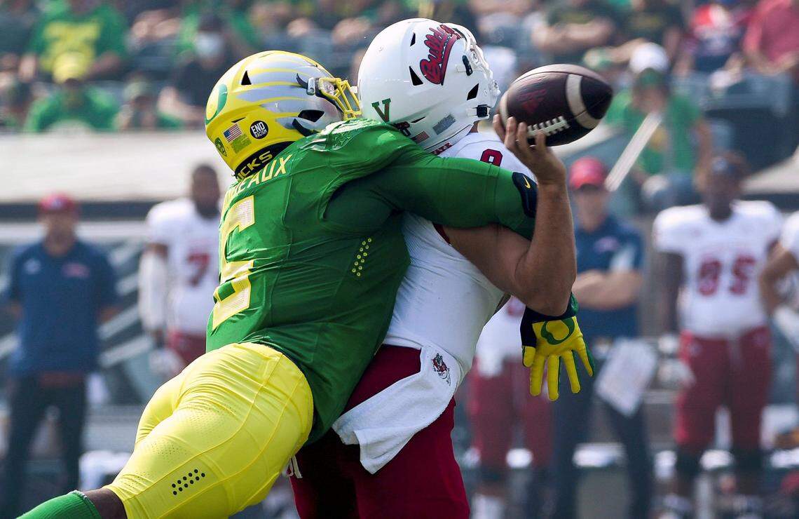 Oregon linebacker Kayvon Thibodeaux hits Fresno State quarterback Jake Haener, causing a fumble during the first quarter of the Ducks’ 31-24 victory, Saturday, Sept. 4, 2021. Oregon turned three Fresno State turnovers into two touchdowns and a field goal in the game.