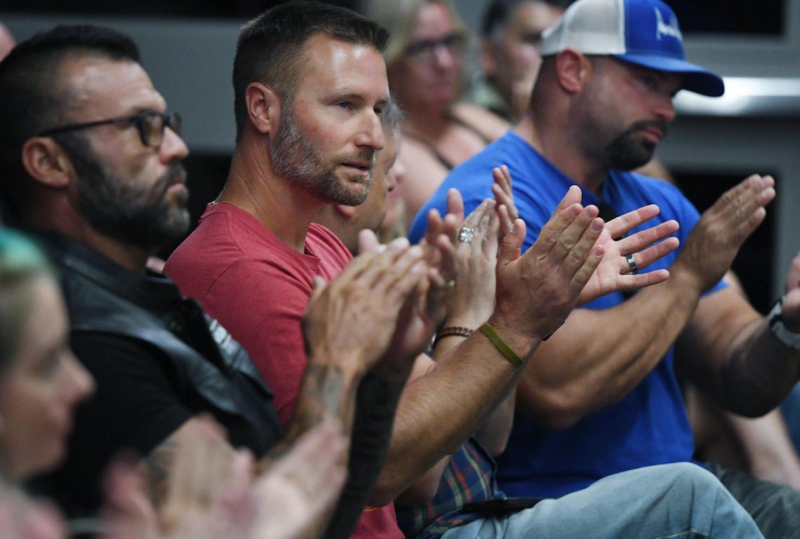Parents applaud after a fellow parent voiced opposition to the Clovis Unified School Board’s anouncement they would adhere to the state’s health protocols for mask-wearing at schools Wednesday night, Aug. 11, 2021 in Clovis.