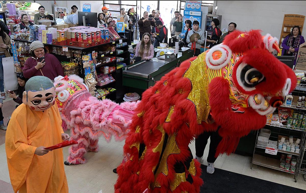 The Chinese New Year Lion Dancers perform inside Central Fish Company Saturday morning, Jan. 25, 2025 in Fresno’s Chinatown.