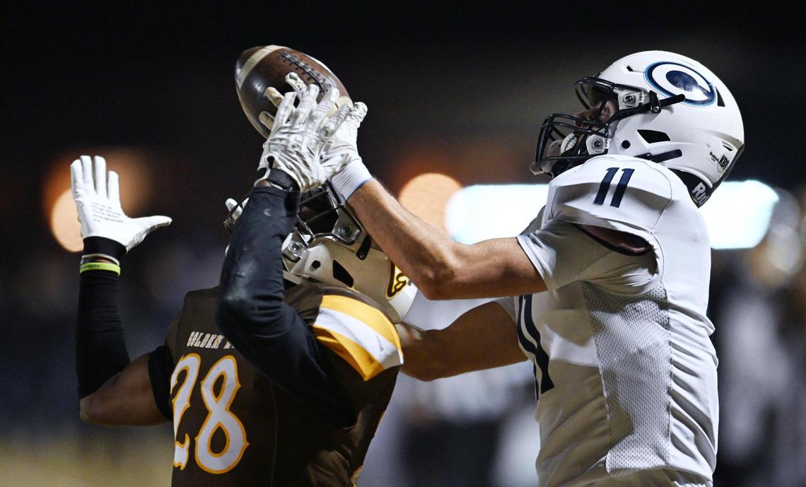 Golden West’s Isaac Saddler, left, breaks up a pass to Central Valley Christian’s Gunnar Piepgrass, right, in the D2 semifinal championship game Friday night, Nov. 22, 2024 in Visalia.