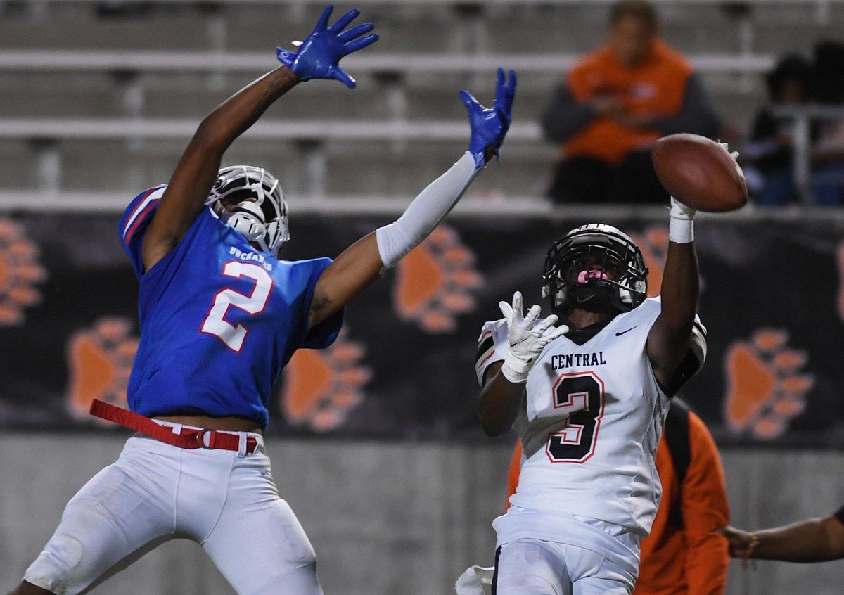 Buchanan’s Robert Johnson, left, on a pass intended for Central’s LaDanian Streets, right, in game action Thursday, Oct. 7, 2021 in Clovis.