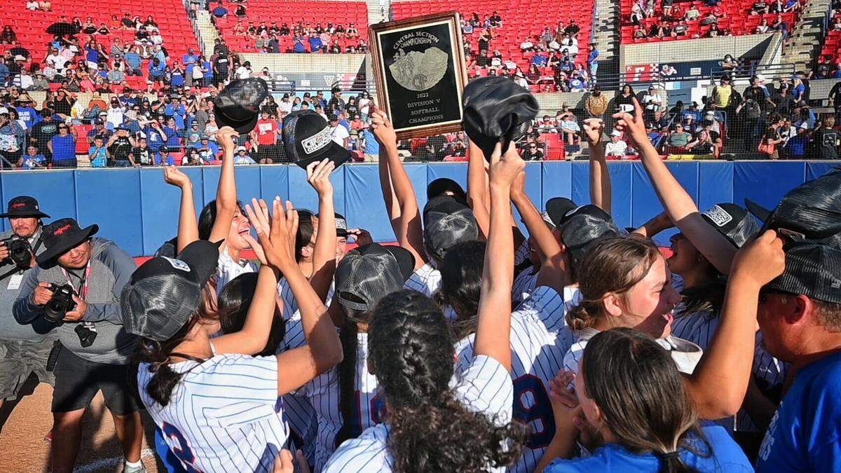 With the championship plaque held high, Caruthers High celebrates its Central Section Division V championship win over Boron on Saturday, May 28, 2022.