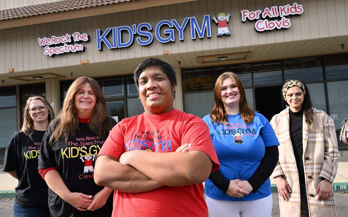 Christopher Reyes, center, surrounded by staff, will be opening his new business called We Rock The Spectrum - Clovis in March of 2026, which as a sensory gym, will host a safe and friendly environment for children with autism. Photographed Tuesday, Dec. 23, 2025 in Clovis, CA. 