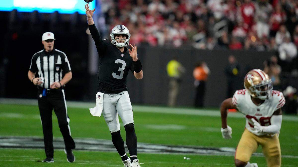 Las Vegas Raiders quarterback Jarrett Stidham throws a 24-yard touchdown pass to tight end Darren Waller during the first half of an NFL football game between the San Francisco 49ers and Las Vegas Raiders, Sunday, Jan. 1, 2023, in Las Vegas.