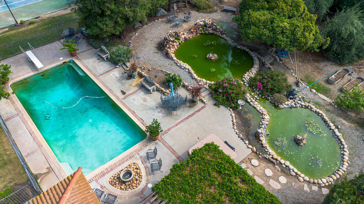 The Balfe Ranch House includes a pool and fish ponds.