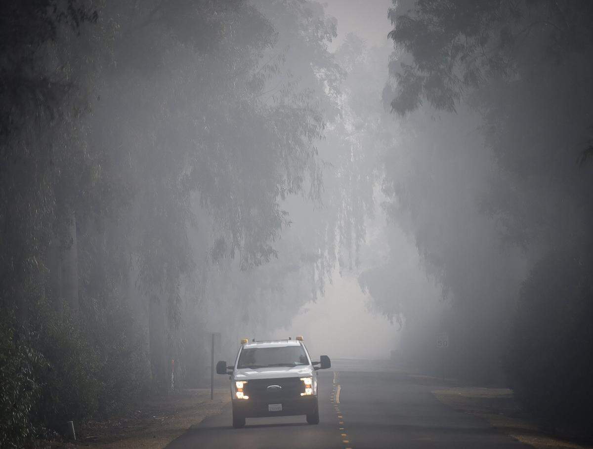 A service truck travels through the fog Tuesday morning, Dec. 18, 2018, on Kearney Boulevard.