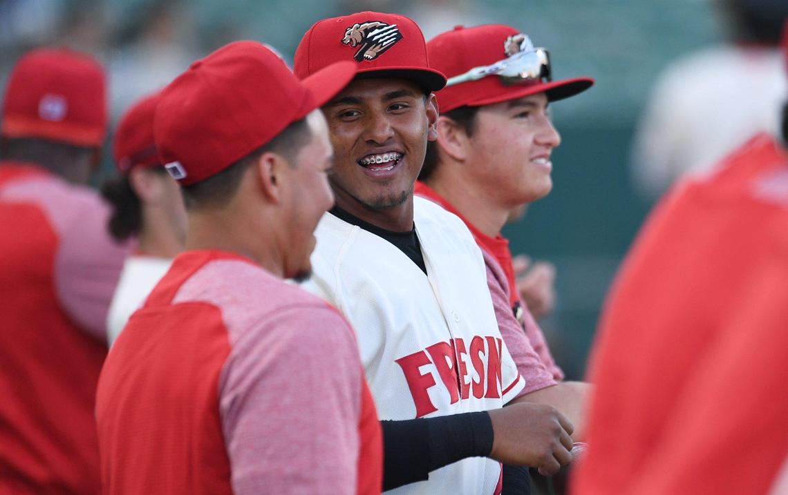 The Fresno Grizzlies dugout prepares for the start of the season opener against the Stockton Ports Friday, April 8, 2022 at Chukchansi Park in Fresno.