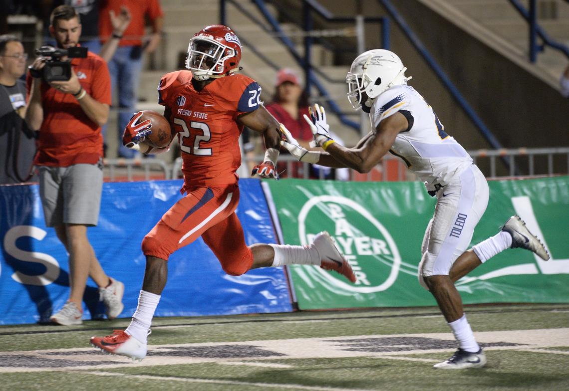 Fresno State sophomore Jordan Mims races to the end zone on a 47-yard touchdown pass from Marcus McMaryion in a 49-27 victory over the Toledo Rockets at Bulldog Stadium on Saturday, Sept. 29, 2018. Mims, with 126 receiving yards, became the first Fresno State running back to top 100 receiving yards in a game since Paris Gaines in 2000.