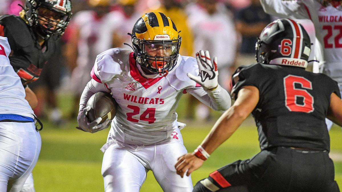 Sunnyside’s Daequan Jones stiff-arms his way for a touchdown against McLane during their football game at McLane Stadium on Friday, Oct. 21, 2022.