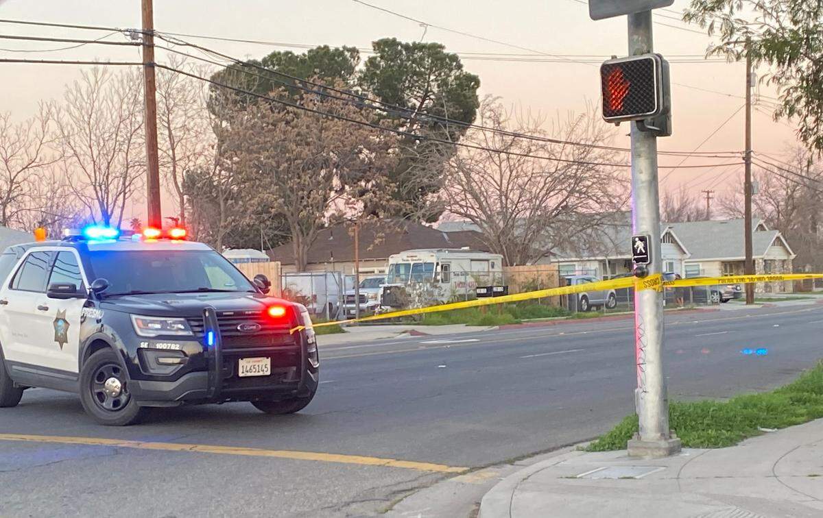 Police taped off E. Olive Avenue after a woman was found dead in a home in Fresno, California on Wednesday, Feb. 26, 2025.
