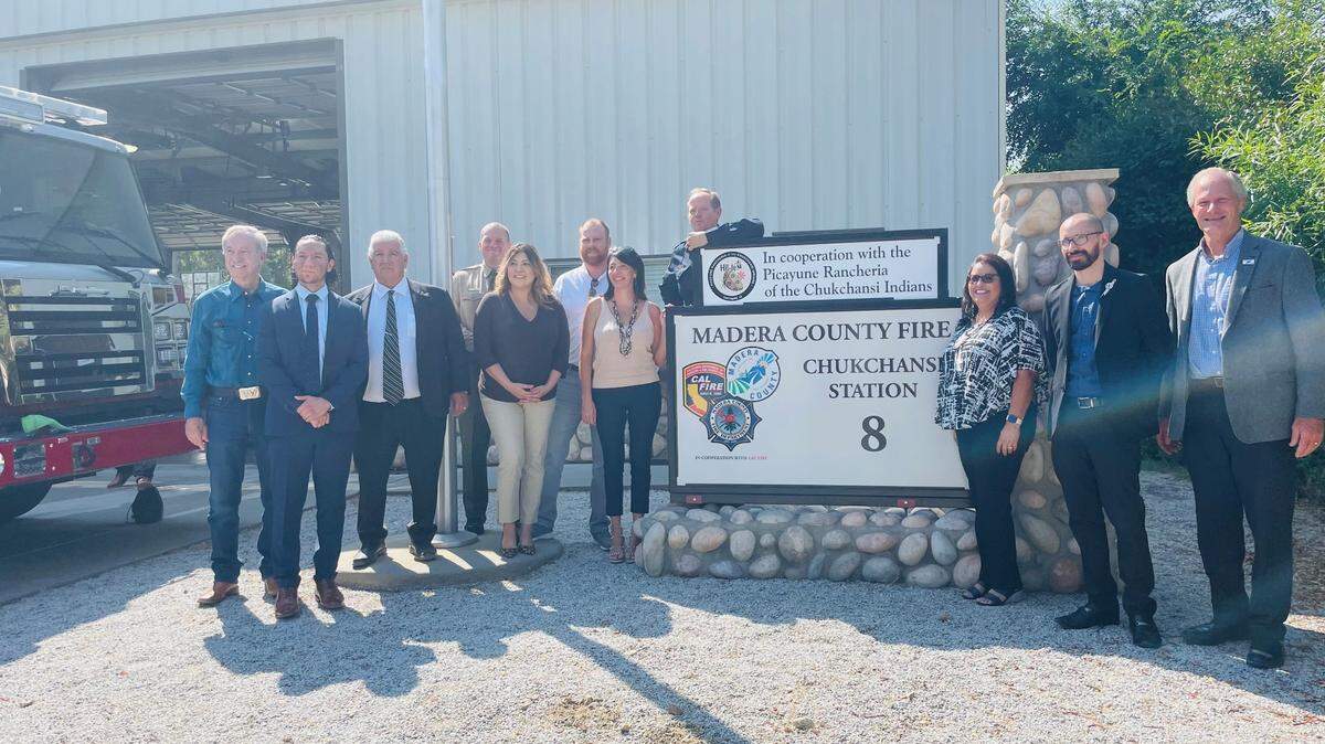 The Picayune Rancheria of the Chukchansi Indians and Madera County offiicials unveil a new sign at Fire Station 8 that celebrates an agreement that includes more money for the station.