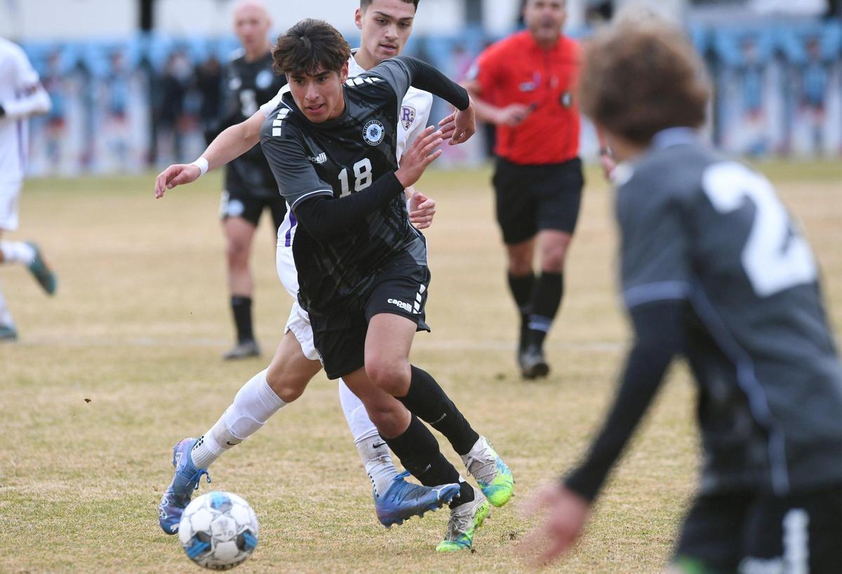 Clovis North’s Bryan Lopez, center, is chased by Ridgeview’s Joshua Bryant in the Central Section Boys Division I soccer championship Saturday, Feb. 25, 2023 in Clovis. Lopez scored the first and third goals in the team’s 3-1 win over Ridgeview.