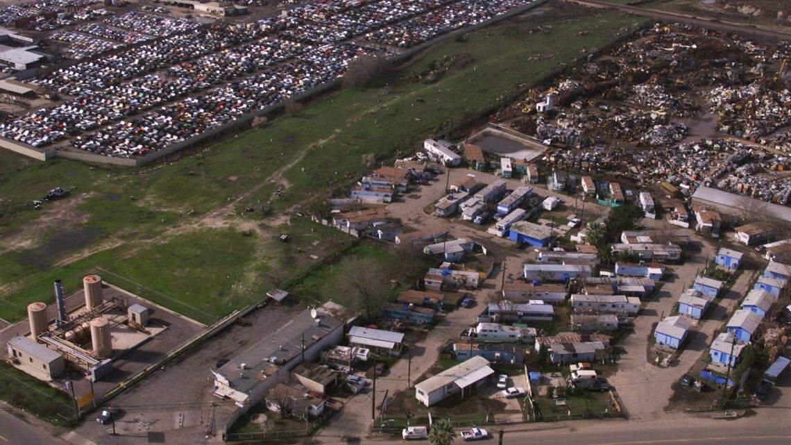 The community of Malaga is no stranger to environmental problems. In this 2000 photo, the Tall Trees mobile home park, lower right, is nestled between a salvage scrap yard, upper right, a Superfund hazardous waste cleanup site of the former Purity Oil plant, running from lower left to upper right, with the water treatment facility for contaminated water at the site, lower left, and an auto wrecking yard, upper left.