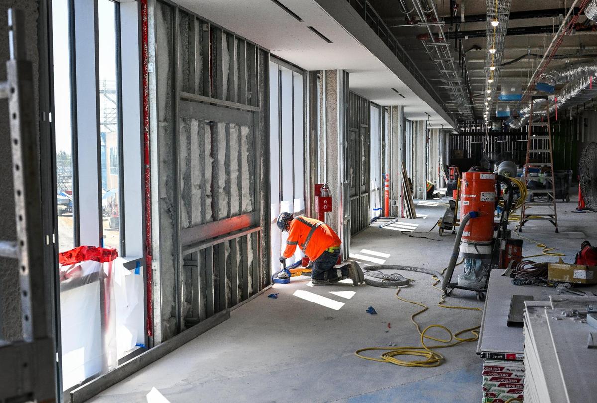 Crews work on the interior of the new terminal wing under construction at Fresno Yosemite International Airport on Wednesday, April 23, 2025.