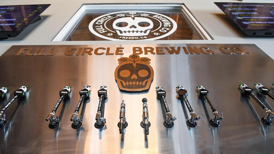 A new splash guard with taps and custom logos adorn the bar area at Full Circle Brewing, which will be having its grand opening event at Fulton and Mono streets in downtown Fresno on Friday and Saturday, May 7 and 8, 2021.