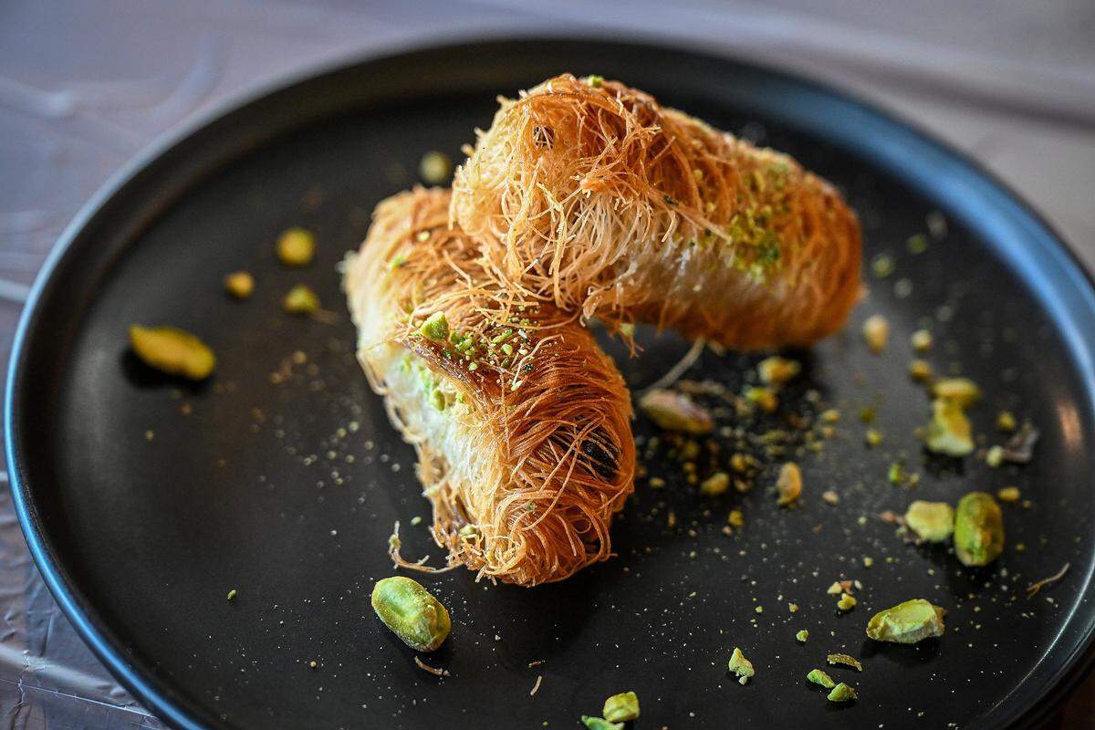 Pistachio kataifi pastry rolls are among the Middle Eastern desserts available at Al-Hadara Mediterranean Restaurant & Cafe which recently opened northeast of Blackstone and Shaw.