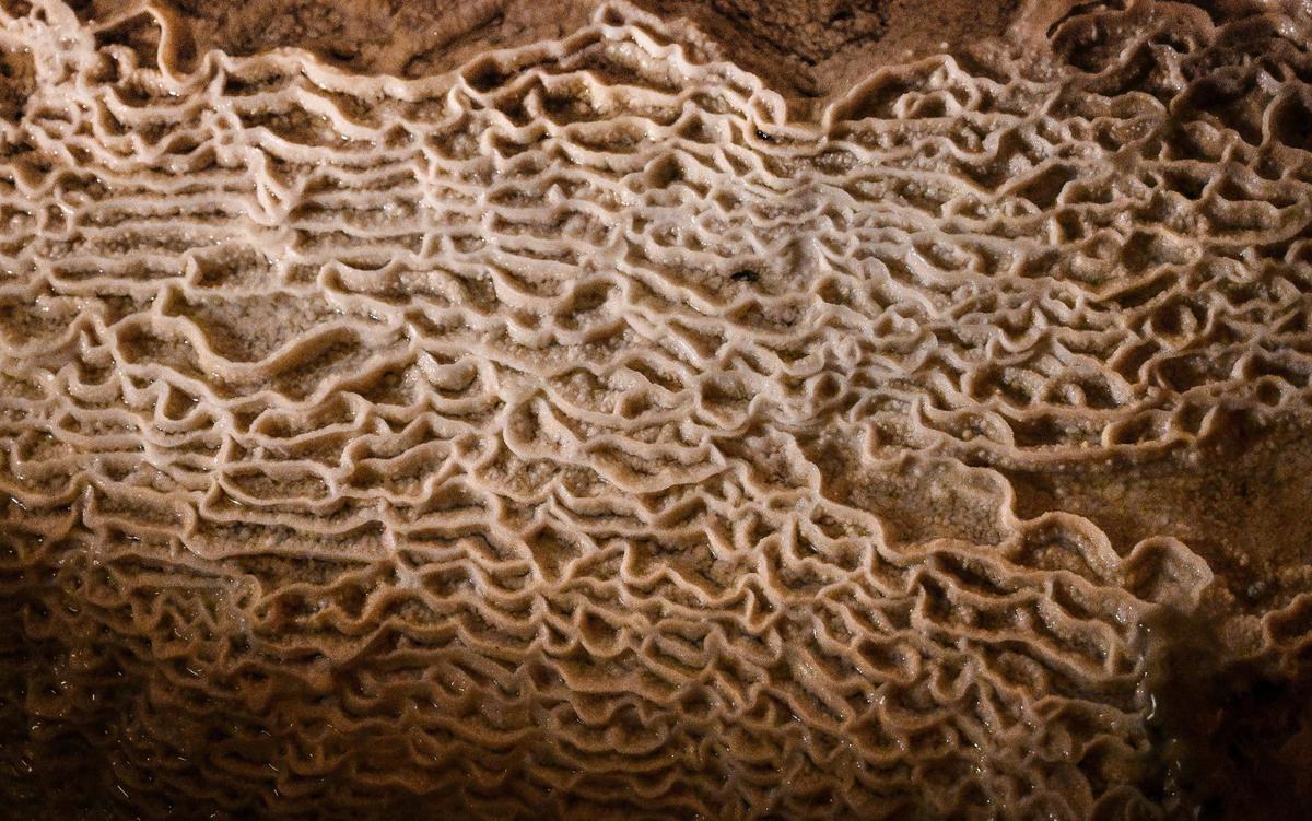 Calcium carbonate formations appear in the fairy pools of Crystal Cave where visitors can once again see inside the ancient cave after it’s reopening following years of being closed.