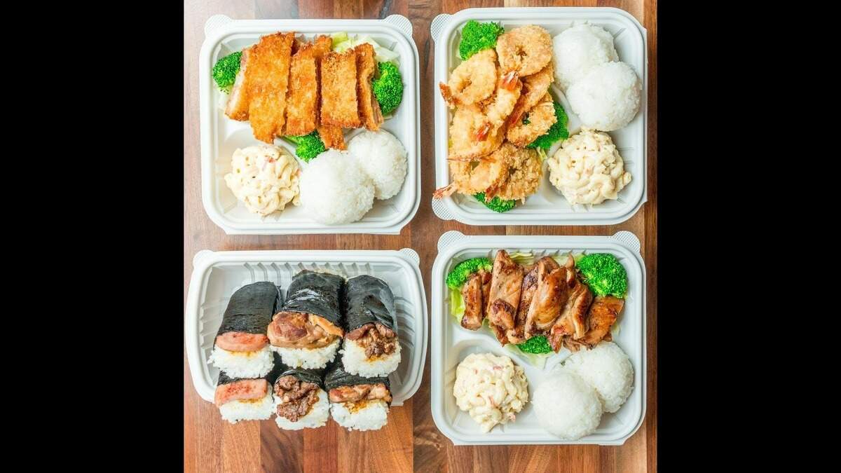 Ono Hawaiian BBQ sells plate lunches like these with white rice, macaroni salad and a choice of protein, like chicken or shrimp. Spam musubi, and other types of musubi (rice and meat wrapped in seaweed) are pictured on the lower left.