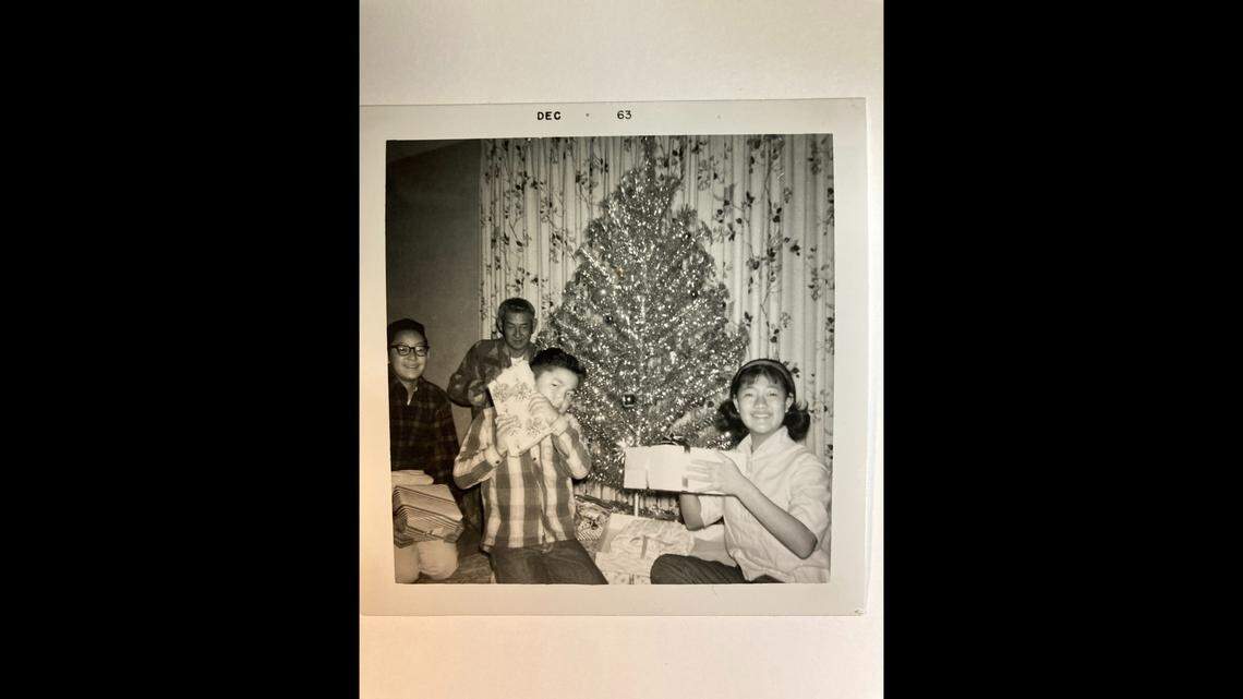 The Masumoto family and the aluminum Christmas tree. David Masumoto still puts it up each holiday season.