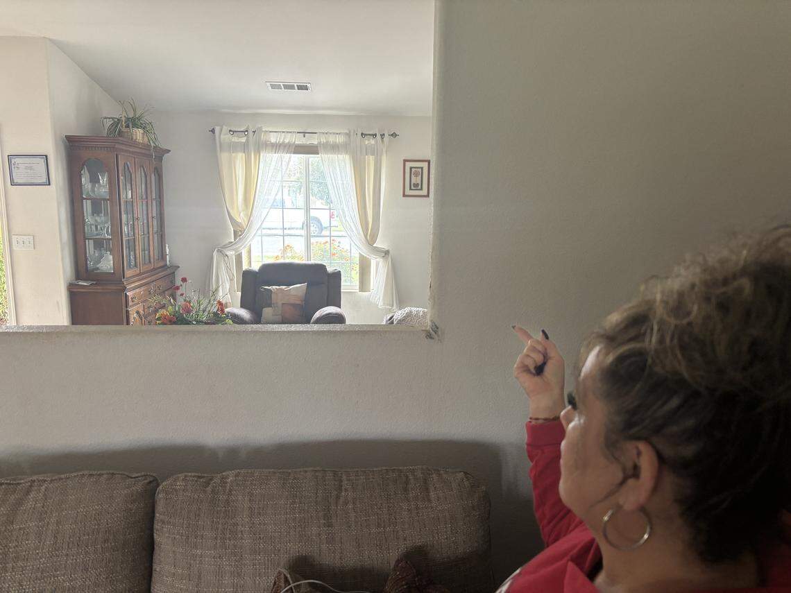 Daniela Pedraza on Monday, April 13, 2026 shows the spot inside her house in Porterville, California where she saw deputies taking cover during an ambush that killed Tulare County deputy Randy Hoppert on April 9. 