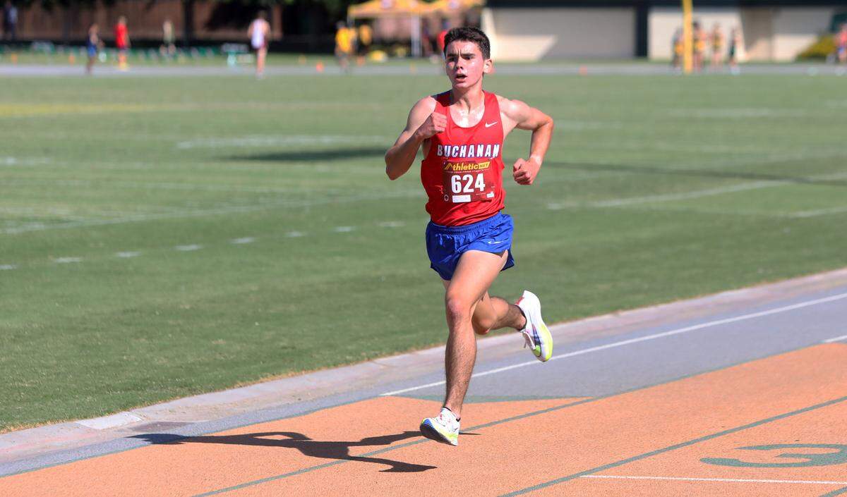 Buchanan High junior Luke Sanders finished first in 9:42.39 in the junior boys race of the Kingsburg 2 Mile cross country meet at Kingsburg High on Sept. 9, 2023.