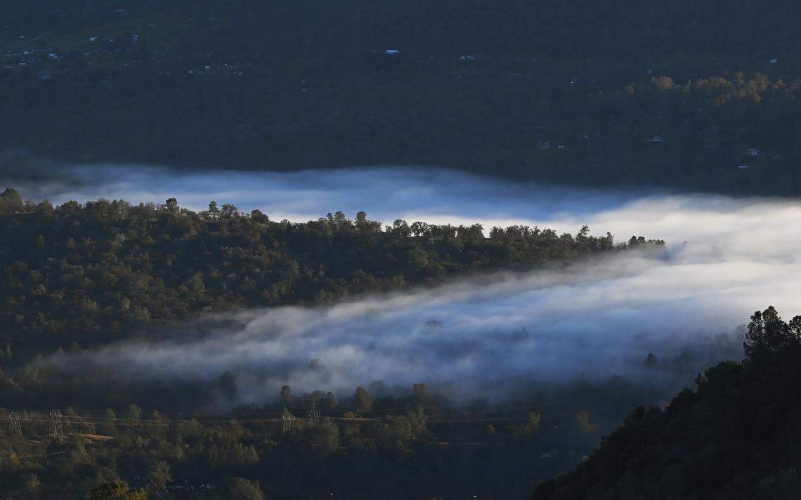 Fog drifts into the foothills as the Valley is covered by a thick blanket of cloud, seen from the 168 “four lane” around the 4,000 foot elevation Thursday afternoon, Dec. 11, 2025 near Prather.