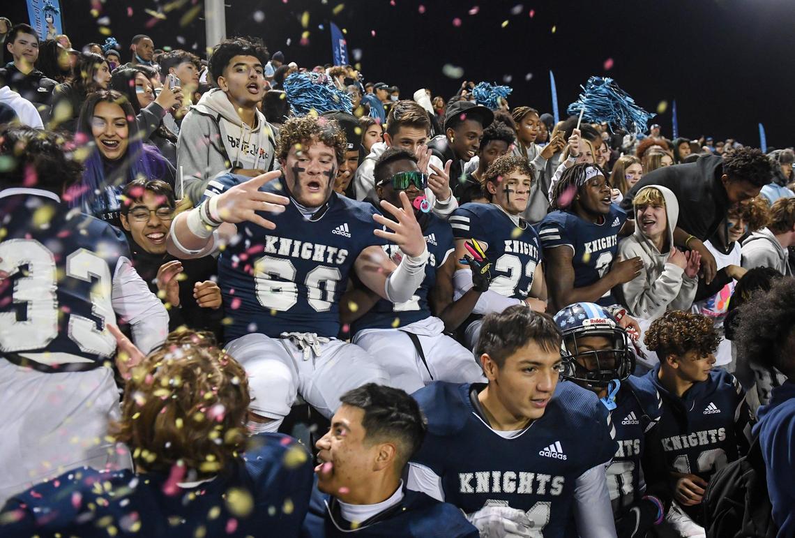 Members of the Bullard High football team celebrate in the student section after clinching the Central Section Division II football championship against Bakersfield at McLane Stadium on Friday, Nov. 26, 2021.