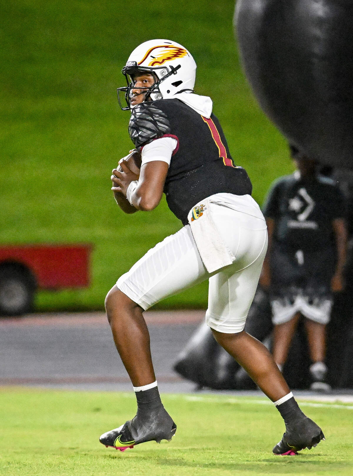 Clovis West quarterback Jamar (JJ) Howard looks to throw in the first half of their game against Edison at Veterans Memorial Stadium in Clovis on Friday, Sept. 5, 2025.