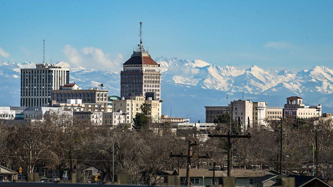 Fresh snow covers the Sierra Mountains east of downtown Fresno’s skyline on a clear day on Tuesday, Jan. 6, 2026.