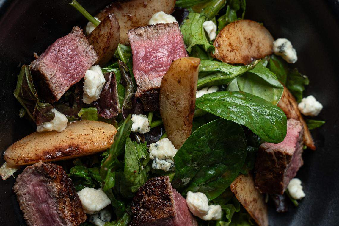 The steak salad is new on the menu at The Standard. It features a petite filet made to order, with spinach and candied peaches.
