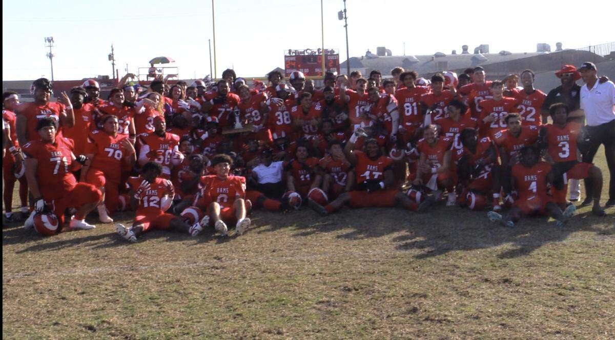 The Fresno City College football team poses with “The Pump” after defeating Reedley 24-21 in the Battle for the Pump at Ratcliffe Stadium on Saturday, Nov. 4, 2023.