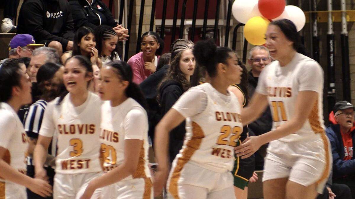 Riley Walls is congratulated after she made a 3-pointer at the buzzer just before halftime for Clovis West. The Golden Eagles defeated San Ramon Valley 69-62.