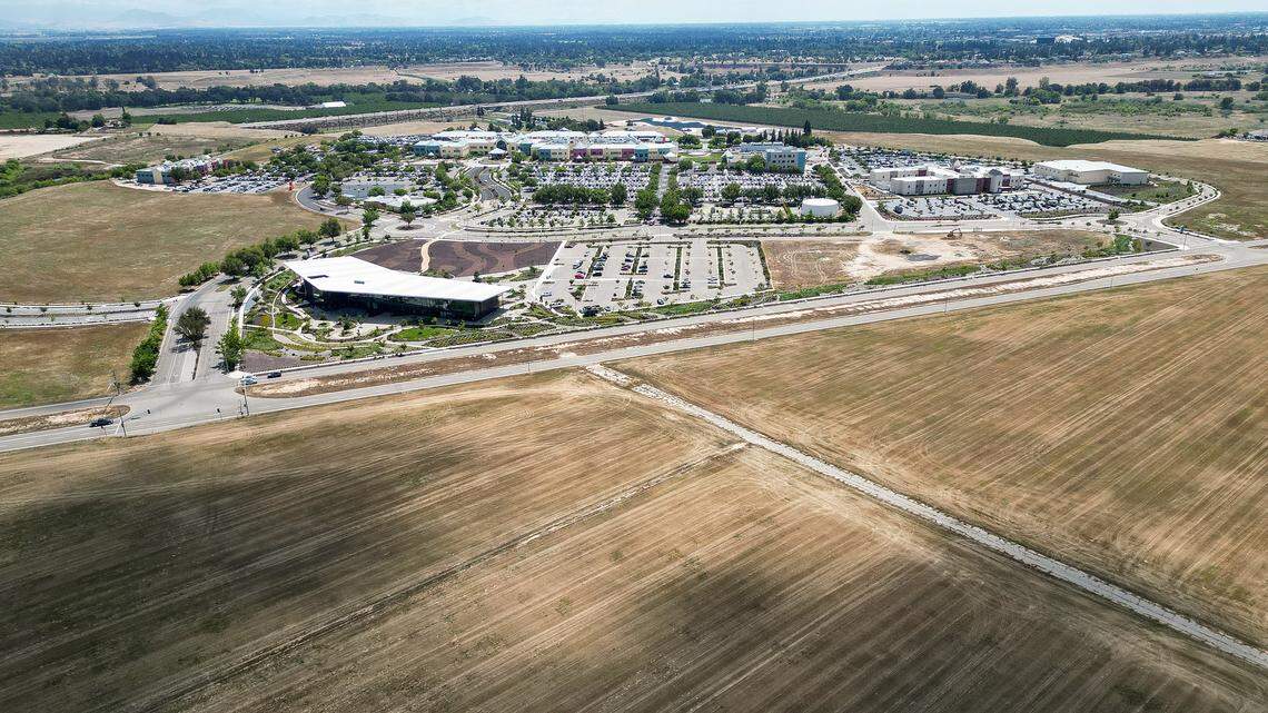 Valley Children's Hospital appears in the background with part of the 277 additional acres of land it purchased in the foreground just below Children's Boulevard in Madera County on Monday, April 27, 2026.