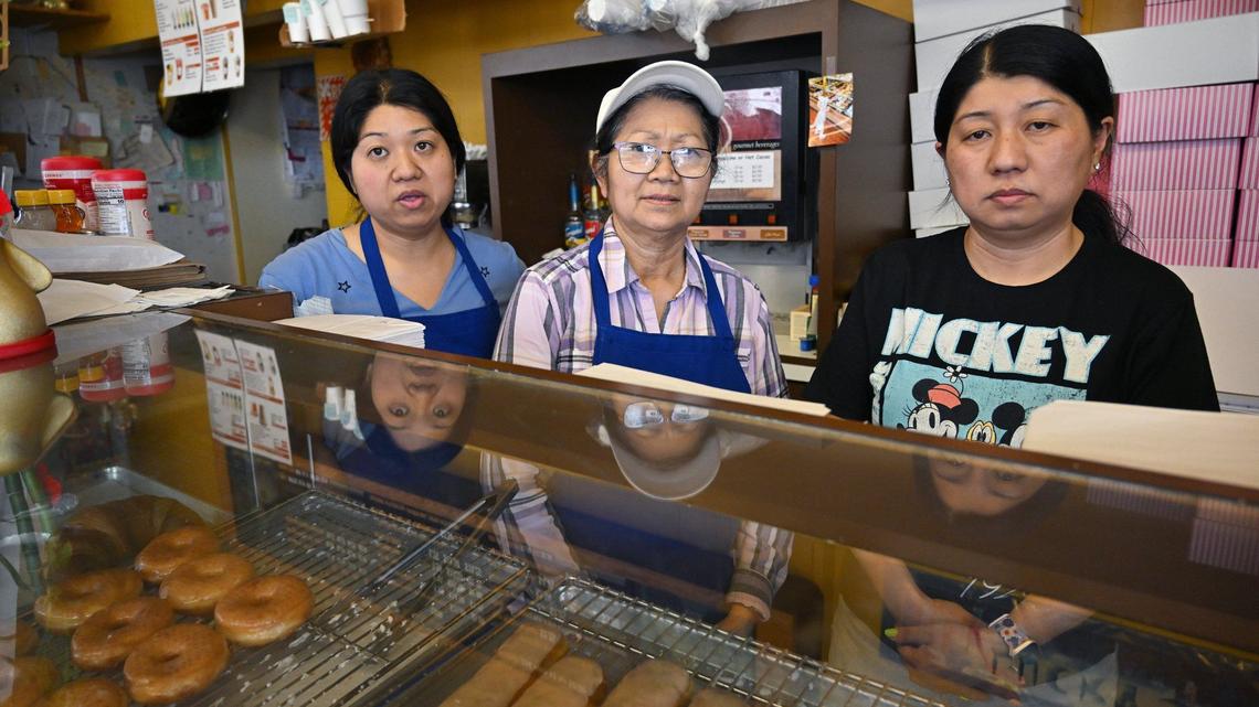 Judy Taing, left, with her mother Lee Taing, center, and sister Katie Taing, right, talk about their impending move after the property owner gave them notice to leave, closing down the family’s Lucky’s Donut House location after over 30 years at Shields and West avenues. Photographed Monday, May 20, 2024.