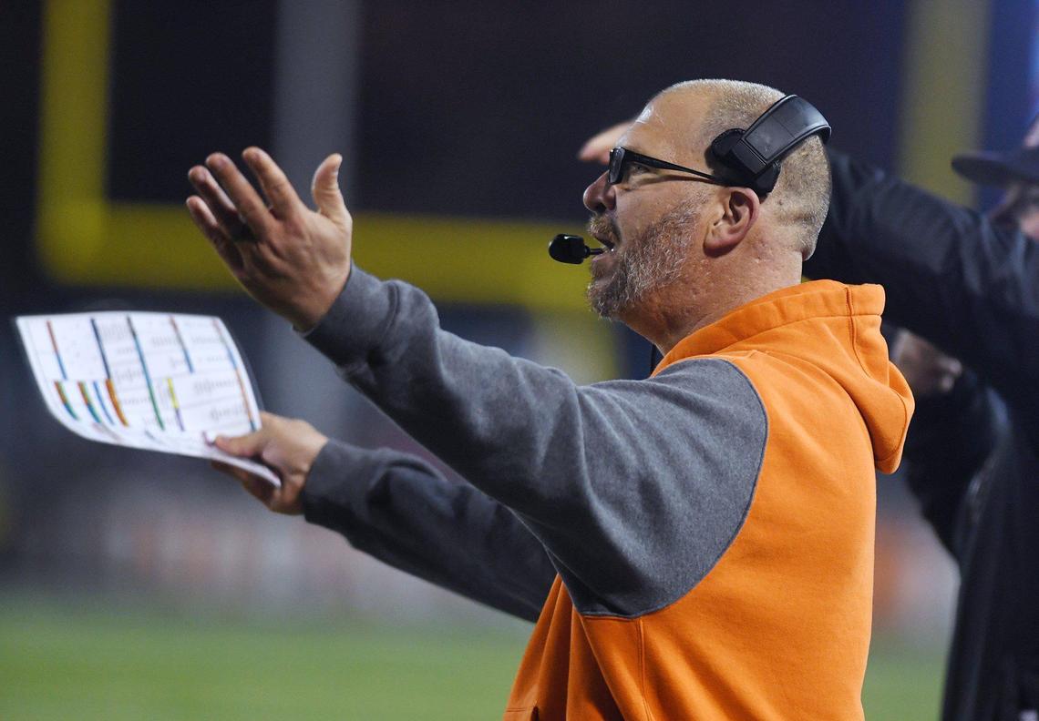 Central’s head coach Kyle Biggs, center, reacts to a call in the game against Liberty-Bakersfield in the Central Section DI championship Friday, Nov. 26, 2021 in Fresno. Liberty led 35-7 at halftime,