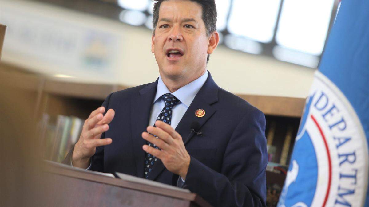 TJ Cox is shown giving a keynote speech in 2019 during his time in Congress. Cox was arrested by the FBI on August 16, 2022 and charged with multiple fraud allegations.