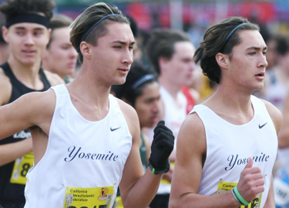 Yosemite’s Jack Olney, left, with his twin brother Ben Olney, right, run in the CIF Boys D-V cross country championships Saturday, Nov. 26, 2022 in Fresno.
