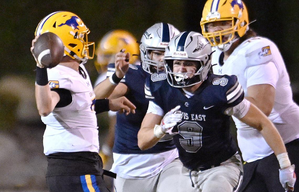 Clovis East’s Joshua Wilson, right, pressures Grant Union quarterback Luke Alexander, left, Friday, Sept. 13, 2024 in Clovis.