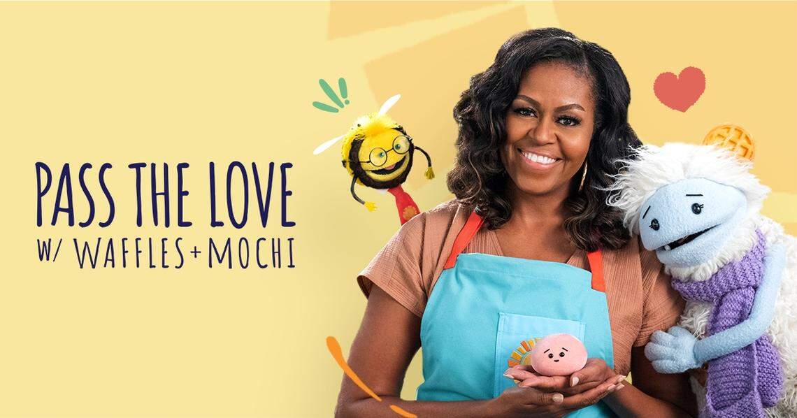 Former First Lady Michelle Obama poses with ‘Waffles + Mochi’ as part of the ‘Pass the Love’ campaign.