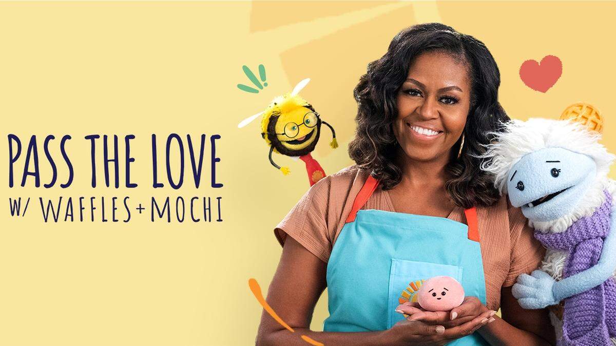 Former First Lady Michelle Obama poses with ‘Waffles + Mochi’ as part of the ‘Pass the Love’ campaign.