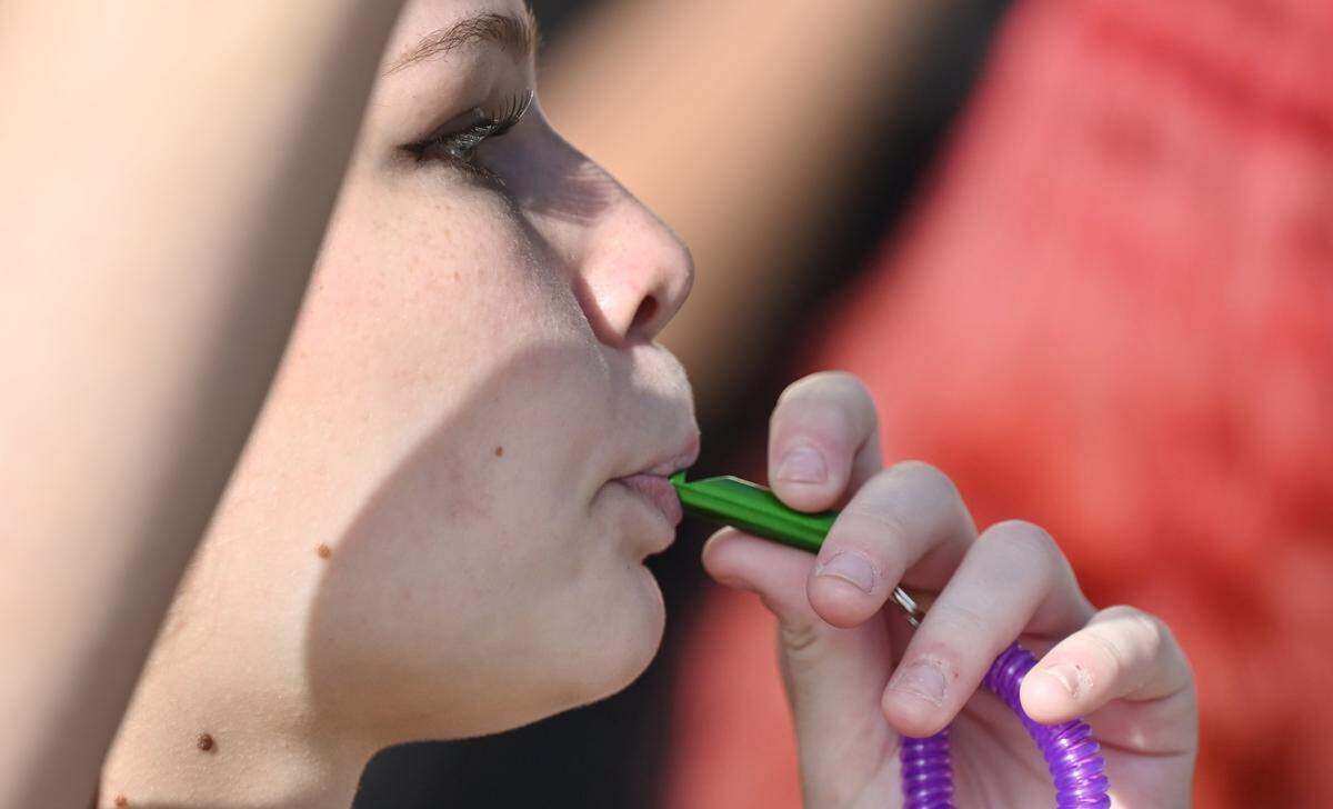 A student blows her whistle as hundreds of Fresno High School students protesting ICE march through town to the Fresno Unified School District offices downtown Friday afternoon, Jan. 30, 2026 in Fresno.