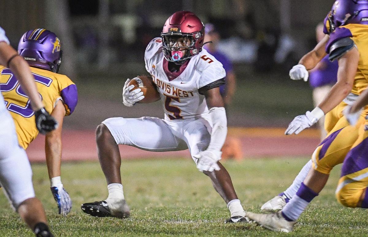 Clovis West’s Marshel Sanders, looks for an opening on a kick return against Lemoore in the second half of their game at Lemoore High on Friday, Sept. 2, 2022.