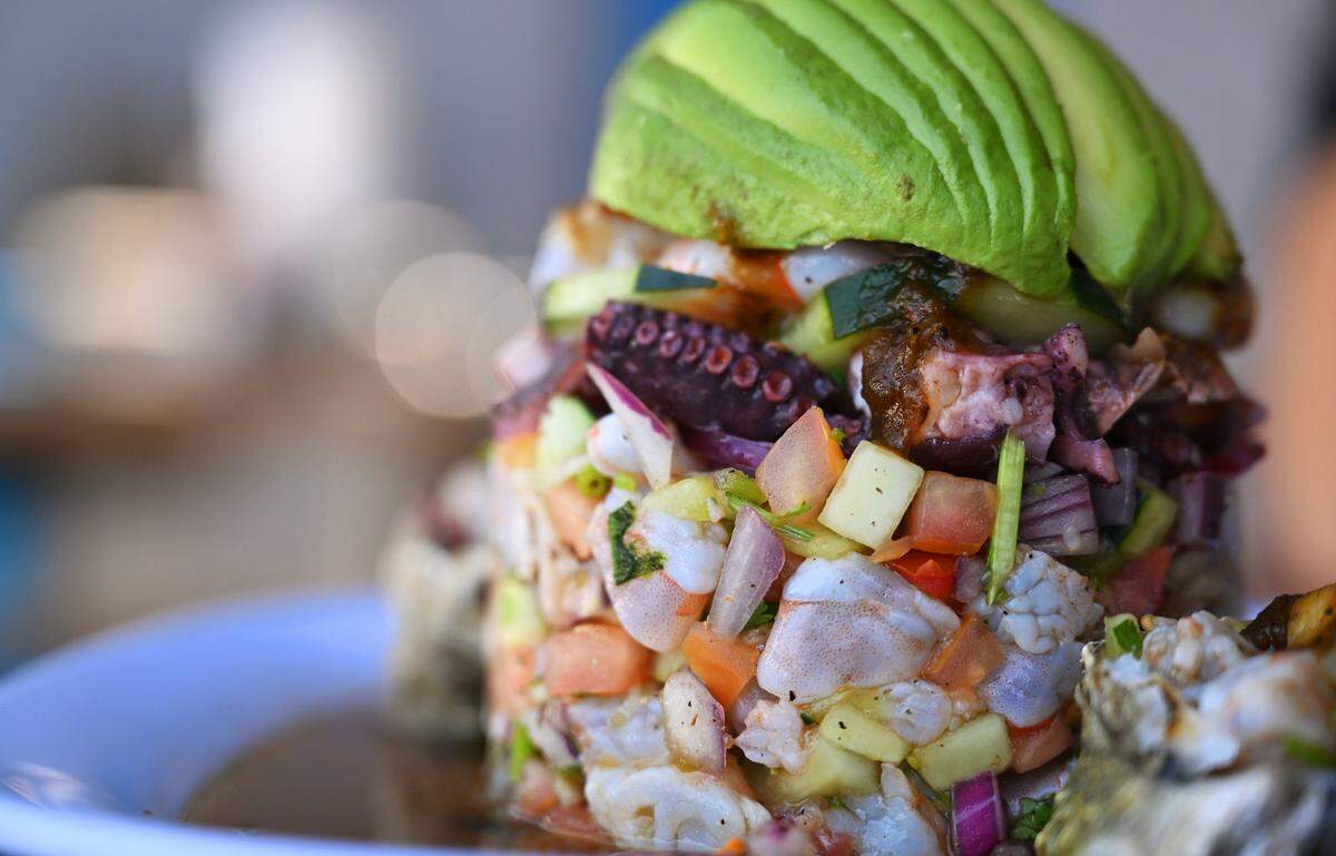 El Botanero Torre is served at El Botanero Mariscos in Fresno, offering Mexican seafood style from Sinaloa. The torre is formed with shrimp, scallops, oysters, octopus and more, topped with avocado. Photographed Wednesday, August 6, 2025 in Fresno.