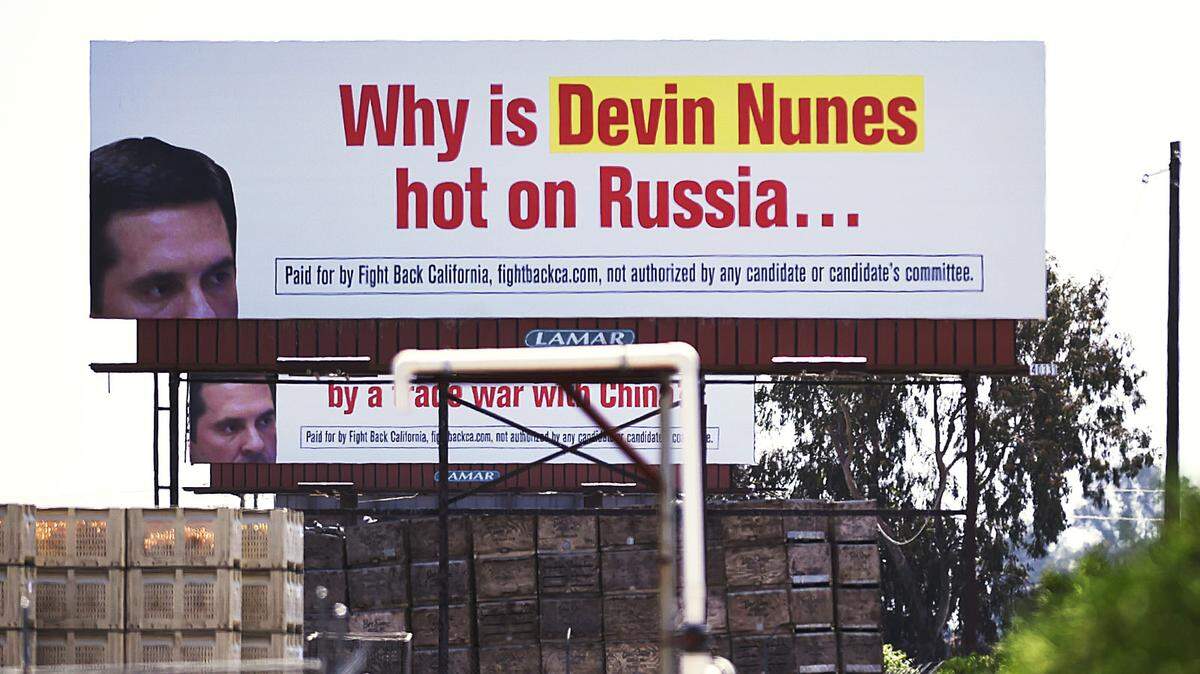 Two of three billboards directed at Devin Nunes can be seen along Highway 99 Thursday, May 24, 2018 near Fowler.