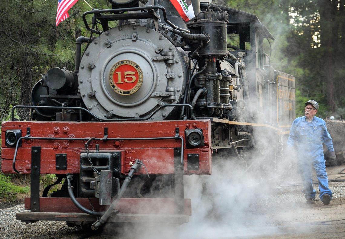 Engineer Greg Haywood looks over the number 15 Shay locomotive before departing for a Yosemite Mountain Sugar Pine Railroad “moonlight special” excursion through the Sierra National Forest on Wednesday, June 6, 2019.