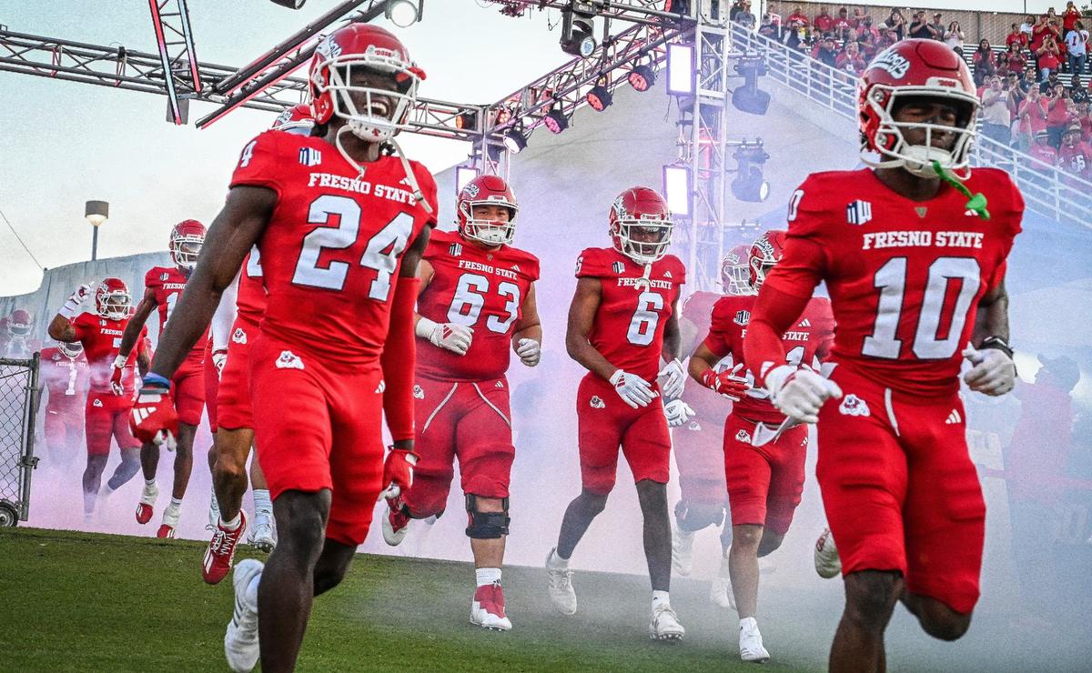 Fresno State players run out onto the field for their first home game of the season against Sacramento State at Valley Children’s Stadium on Saturday, Sept. 7, 2024.