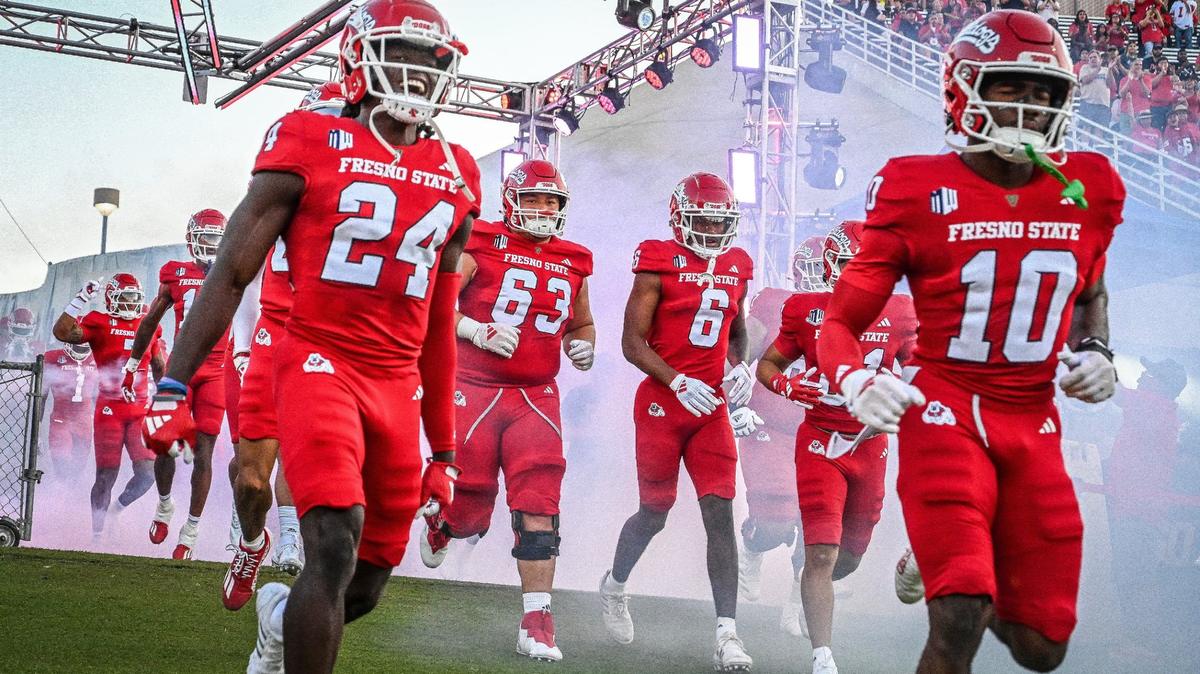 Fresno State players run out onto the field for their first home game of the season against Sacramento State at Valley Children’s Stadium on Saturday, Sept. 7, 2024.