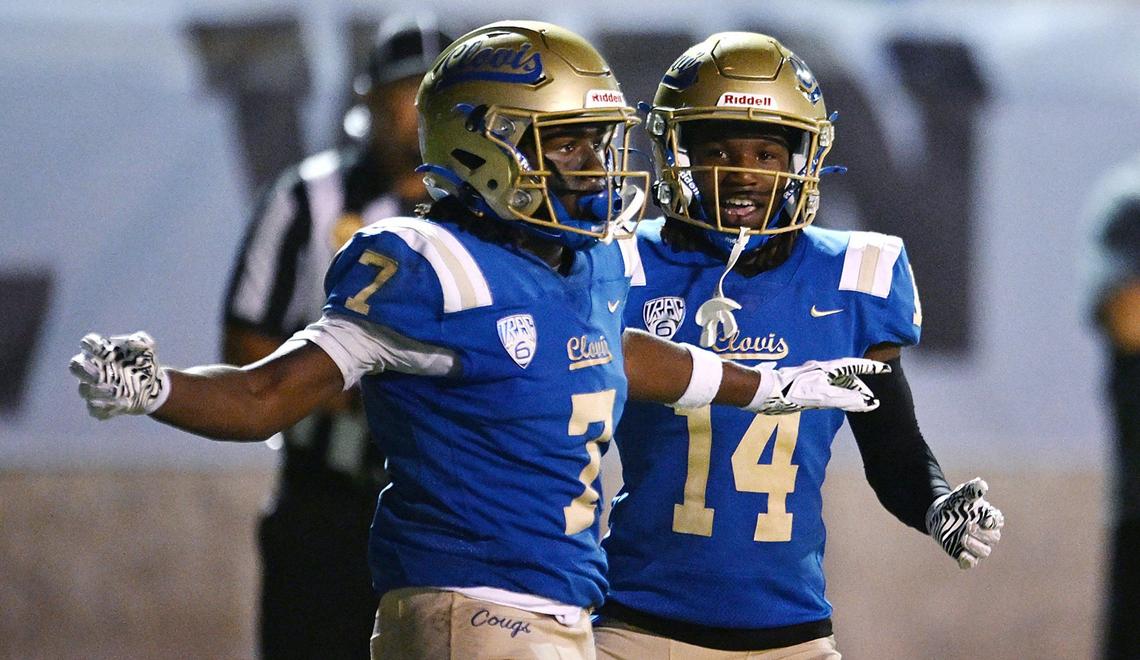 Clovis High’s Sterling Edwards, right, helps celebrate’s Dezjour Malone’s touchdown against Bullard Friday night, Sept. 20, 2024 at Lamonica Stadium in Clovis.