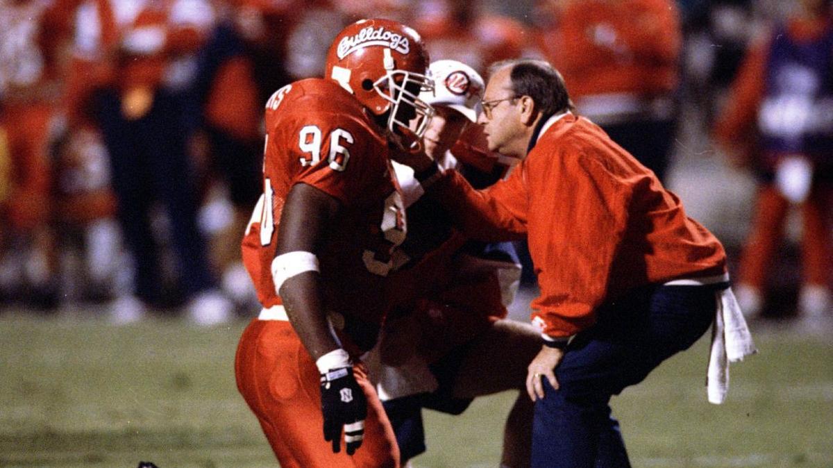 Former Fresno State trainer Paul Schechter tends to injured defensive lineman Danny Williams. Schechter, who worked with Bulldogs’ student-athletes for 27 years and was a member of three halls of fame died June 21, 2019.