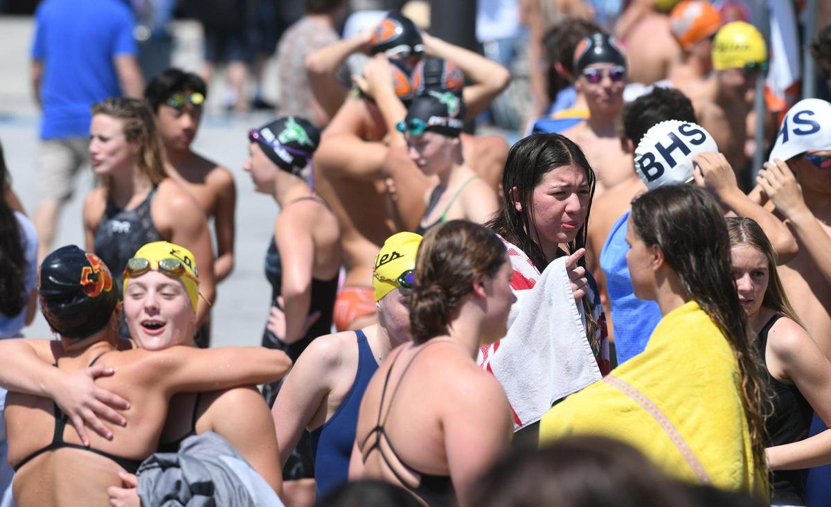 Swimmers gather behind the starting blocks at the Clovis West Invitational Saturday, April 15, 2023 in Fresno. Clovis Unified’s Olympic Swim Complex at Clovis West opened this week after being closed almost a year for renovation and construction.
